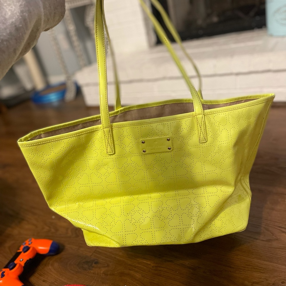 Neon yellow Kate spade bag and wallet